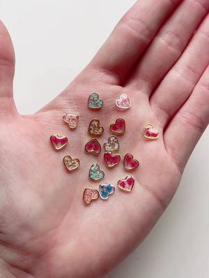 A post by @ediesco on TikTok caption: Love these little heart charms 🤍 #handmadejewelry #handmade #etsyshop #jewellery #etsy #orders #makingorders #SmallBusiness #etsyseller #packaging #packagingorders #fyp