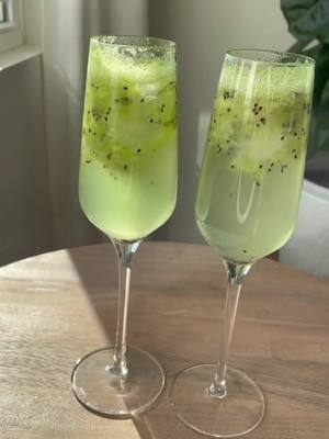 A post by @drink_hubb on TikTok caption: Kiwi Mimosa✨ #cocktails #drink #food #foryou 