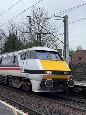 A post by @westcoastelectrics on TikTok caption: Hey everyone! Here’s 91119 passing Outwood station with an LNER 225 service bound for Leeds! I hope you enjoy! 💙