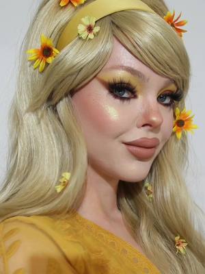 A post by @beatsbylizzie on TikTok caption: Spring makeup vibes 🌼🌻🌞 #yellowmakeup #yellowmakeuplook #70smakeuplook #vintagemakeup #cutemakeuplook #springmakeup 