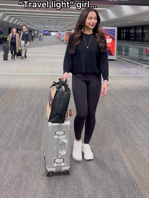 A post by @janelacuaton on TikTok caption: Behind every “travel light” girl….