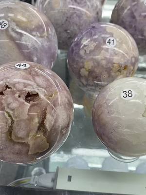 A post by @ceeportcrystalus10 on TikTok caption: Pink Amethyst spheres and free forms and Ocean jasper free forms.Which crystal do you like?😉