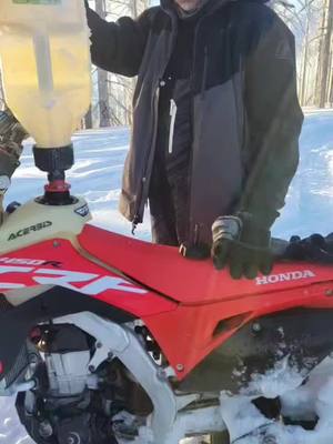 A post by @ripper_208 on TikTok caption: 🇺🇸🤘 #merica #backcountry #getoutside #brapp #sledlife #snowbike #snowbiketime  #snowbikes #idaho #208 #7b #pnw #509 #klim #2stroke #brp #hillclimb #kenblock #snowmobiletok #snowmobilelife #fyp #honda #ktm #getoutside #happyface