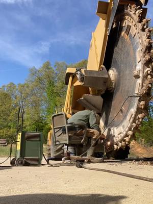 A post by @heiferdad on TikTok caption: Hardsurfacing for next job#mtexcavating  #rocksawing 