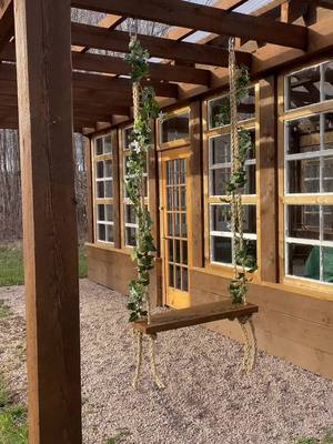 A post by @aframe.on.fletcher on TikTok caption: Cutie swing made with reclaimed wood and a few things from Home Hardware 🥹🫶🏼 #diyswing #reclaimedwood