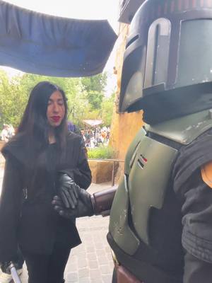 A post by @xo.daisyyyy on TikTok caption: The little hand squeeze! 😳 #bobafett #bookofbobafett #bookofboba #disneyland #galaxysedge #battuu #sithcosplay #starwarsnite #maythe4th #revengeofthe5th