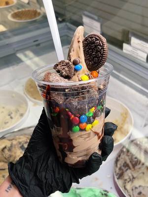 A post by @licsicecream on TikTok caption: What should we name this masterpiece?! 🤌😋 #icecream #scoop #Summer #northport #gelato #fyp #satisfying #sprinkles #candy #swirl #chocolate 