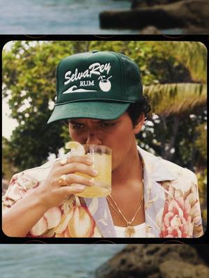 A post by @brunomars on TikTok caption: Are you ready for the summer? Do you want to enjoy a summertime cocktail and not worry about all those pesky calories? Have you found yourself looking in the mirror saying what have I become? If so, I have a solution for you. It’s called "The Hollywood Colada" by SelvaRey. 4 simple ingredients sure to be a hit at your next party: ice, SelvaRey Coconut Rum, coconut water, and pineapple juice. YES it’s that easy! Shimmy off into the sunset with Selvarey Rum. Love, El Capitan Fuego 🔥💃🏽 @Fairmont Hotels & Resorts  #selvareyrum  #thatfairmontfeeling  #fairmonthotels