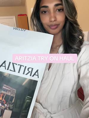 A post by @rafiah.ali on TikTok caption: The cutest little summer haul #aritzia #aritziahaul #aritziaoutfits #hotgirlsummer #fashion #summerlooks #haul #unboxing #tryonhaul#capsulewardrobe #summercollection