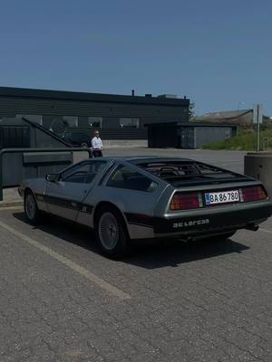 A post by @speedforum on TikTok caption: Didn’t expect to see that 😱 #backtothefuture #dmc #carsoftiktok #carspotting #delorean 