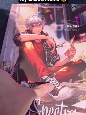 A post by @laovaanart on TikTok caption: My new Artbook is here x) I'll have copies with me at dokomi convention at the end of the month and after that I plan to reopen my Onlineshop again to have it available there internationally 😊 #anime #manga #artistsoftiktok 