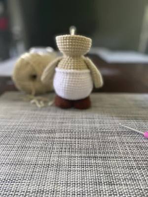 A post by @maggiescustomcreations on TikTok caption: Crochet grad doll and a Toad work in progress