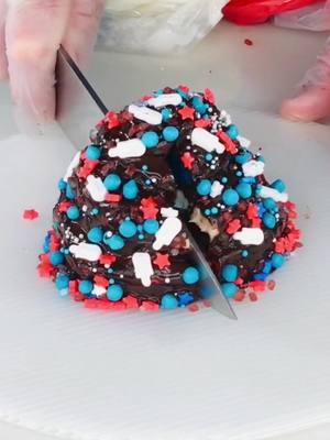 A post by @cheftomlapierre on TikTok caption: 4th of July Brownie Stack 🍫🎇 #4thofjuly #brownie #dessert #chocolate #chocolatebar #cheftomlapierre 