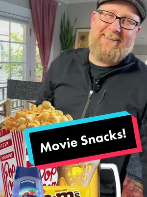 A post by @wait.for.me.media on TikTok caption: Going to the movies is a great experience, from the slightly sticky floors to the popcorn-scented air and shared experience of watching a film with an audience. Of course, no trip to the movies is complete without snacks! My favorite is Junior Mints and, of course, popcorn. Filmmaker and documentarian Justin Monroe recently shared his favorite theater snack—peanuts m&m! What's your favorite? #movies #movieexperience #juniormints #popcorn #justinmonroe #snacks #cinema #m&m #GoingToTheMovies #BelowTheLine #JustinMonroe #HolyFrit #Popcorn 