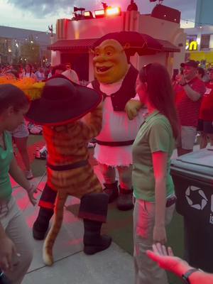 A post by @danimal_mayhem on TikTok caption: For obvious reasons…i had to add this audio. That is all.  🎉 #livinlavidaloca #shrek2 #pussinboots #shrek #universalorlando #4thofjuly #party @DreamWorks Animation 