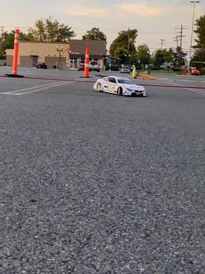 A post by @o_buck on TikTok caption: Parking Lot Racing 😎 #rccars #racing #2stroke #bmw #fg 