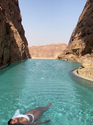 A post by @thelifeofnai on TikTok caption: The Rock Pool at Banyan Tree AlUla is one of the most unique infinity pools I’ve ever experienced 😍 It was built between two natural rock formations, and provides the most peaceful and serene atmosphere - especially when you have it all to yourself!  If this inspires you to visit AlUla, Saudi Arabia, let me know in the comments ⬇️❤️ • • • • #Alula #SaudiArabia #RockPool #InfinityPool #HotelsAbovePar #TravelBlogger #Luxury #BlackGirlsTravel #TravelGram 