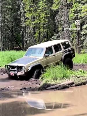 A post by @yyc4wheelers on TikTok caption: When you tell him not to floor it - Uhm yeah okay😌  . . . . . #floorit #sendit #lol #reels #reelsinstagram #reelsvideo #instagram #instagood #jeep #jeepxj #xj #cherokee #wheeling #4x4 #longarm #fun #mudding #mud #xjbuilds #xjaddicts #builtnotbought #tbt #tiktok 