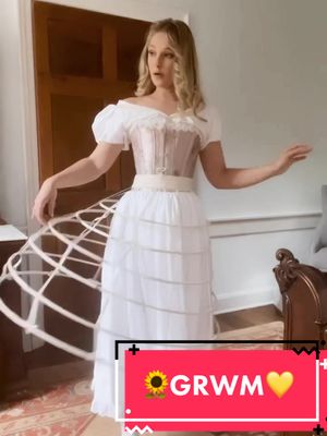 A post by @welldressedhistorian on TikTok caption: #GRWM for a ball! #victorianfashion #victorianball #ballgown #eveninggown #historicalfashiontiktok #hoopskirt #corset #victoriandress #1860sfashion #fyp #sewingtiktok 