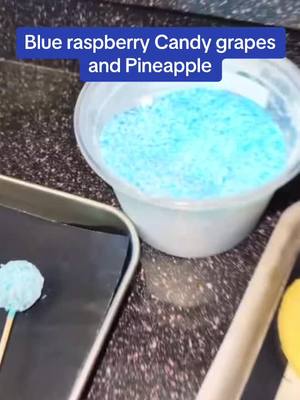 A post by @ayassweetsandtreats on TikTok caption: Blue Rasberry Lollipop 🍭candy Grapes and Pineapple. Peefect for the summer #lollipop #cookwithme #BakeWithMe #candy #treats