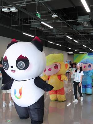 A post by @hangzhouflavor on TikTok caption: Is it not a pleasure to meet friends coming from afar? The mascots of Hangzhou Asian Games are warmly greeted by Rongbao, the panda mascot of the Chengdu Universiade upon their arrival in Chengdu.#GoMascotsGo #Hangzhou #Chengdu #Rongbao #panda #chengdu2021 #FISU