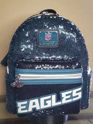 A post by @frogtales7 on TikTok caption: Got me my Philadelphia Eagles Loungefly 😍 #Loungefly #MiniBackpack #Philadephia  #Eagles #PhiladephiaEagles #LoungeflyMiniBackPack #LoungeflyCollection #Collector #Collection #FlyEaglesFly