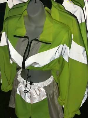 A post by @420nursesboutique on TikTok caption: Light up the night with one of our reflective outfit sets! 😍🌟 #reflective #croptop #glow #bright #420nurse #raveplanet #supportsmallbusiness #womenowned #shoponline