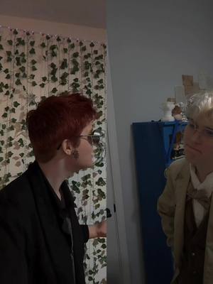 A post by @dadjoke.cos on TikTok caption: #duet with @♡Demon♡OK BUT LOOK HOW CUTE WE ARE-- Does this count as our first fight, @♡Demon♡ ?  #crowleygoodomens #duet #davidtennantedit #davidtennant #crowley #crowleycosplay #aziraphalexcrowley #fyp #queer #michaelsheen #goodomens #goodomensseason2 #aziraphalegoodomens #aziraphalecosplay #azirphaleedit 