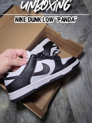 A post by @airasantiago_ on TikTok caption: that dunk low that everyone is wearing 🤷🏼‍♀️ cop or drop? #fyp #unboxing #sneakers #sneakerhead #nike #dunklow #dunklowpanda #obsession @nike @limitededt_sg