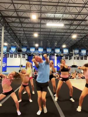 A post by @johndavenport_ on TikTok caption: Midnight riders with the the T-CATS! #cheerathletics #foryou #fyp #viral #midnight #cheer #stunt 