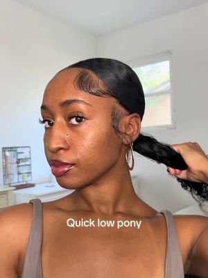 A post by @kirarenee on TikTok caption: Takes no time! #fyp #naturalhair #slicklowpony #lowponytail #hairtutorial #quickhairstyle