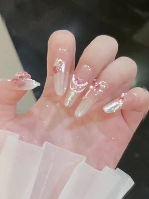 A post by @nailart8708 on TikTok caption: #nails #nailsart #bling 