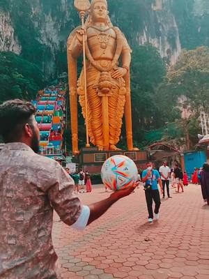 A post by @raghulfootskills on TikTok caption: Skills In Front of Famous Malaysia Murugan Temple 👑 #tiktok #tiktokvideos #raghulfootskills #trending #trend #viral #viralvideo #viraltiktok #messi #meme #Soccer 