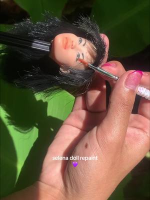 A post by @imvalenciabby on TikTok caption: Selena doll repaint 💜 #selenaquintanilla #selenaylosdinos #dolls #muñecas #dollrepaint #mexico #foruyoupage #fypシ゚viral #arte #💜 