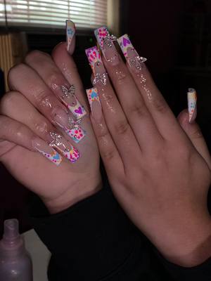 A post by @daisy.babbyyy on TikTok caption: Loved how this set came out 🧡🩷💜💚🩵 #nails #nailsartvideos #nailscheck #nailsdesign 