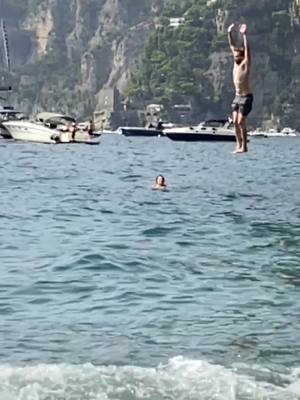 A post by @hank_is on TikTok caption: Cliff jumping in Positano. The judges scored it an 8/10. #positano #amalficoast #italy #fyp