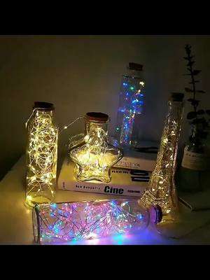 A post by @fairylight_diy on TikTok caption: 🌙Bottle Light Magic🌙#DIY #diyproject #diyprojectsideas #fairylights #evledev #foryou #foryourpage #bedroom