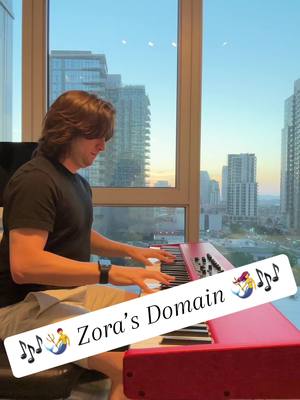 A post by @mustbemerrick on TikTok caption: It even sounds like a waterfall. #piano #music #zelda #totk #botw #zora #zorasdomain #sandiego #cityscape #sunset #beautiful #cat 