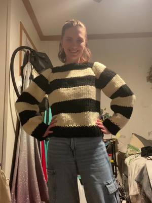 A post by @kbrookes_art on TikTok caption: Knitting my first sweater 🖤🤍#knitting#knittersoftiktok#stripedsweater#fall#fiberarts#sweater#handmade