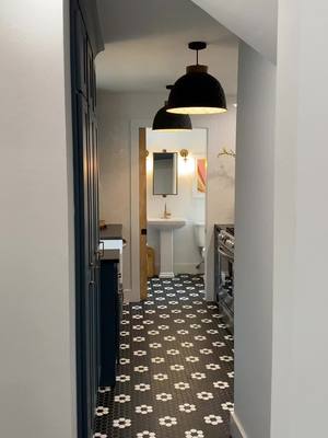 A post by @realestateinokc on TikTok caption: The cutest galley kitchen & tile #kitchen #kitchendesign #tiledesign 