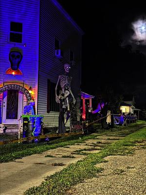 A post by @justjennie87 on TikTok caption: Some night time stills #halloween #halloweendecor #halloween2023 #spookyseason #halloweendiy #halloweencemetery #12ftskeleton #12footskeleton #pukingskelleton #pukingskelly #diyhalloween 