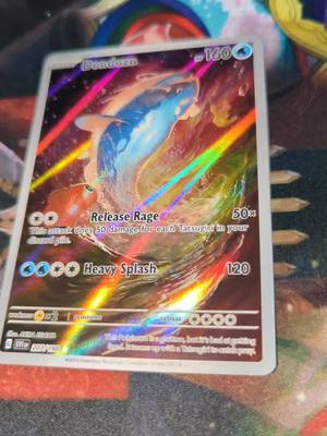 A post by @pokemontrainer_liam on TikTok caption: sometimes you gotta appreciate the foiling 😍 #pokemoncards #pokemoncommunity #pokemontiktok #gottacatchthemall #pokemontrainer_liam #pokemon #dondozo #holo