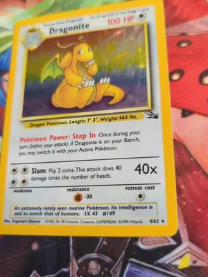 A post by @pokemontrainer_liam on TikTok caption: dragonite looking very pretty 😍#pokemoncards #pokemoncommunity #pokemontiktok #gottacatchthemall #pokemontrainer_liam #dragonite #holo #holodragonite