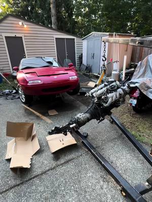 A post by @shoppulse on TikTok caption: Engines out. Fingers were smashed & fluids were spilled. But we are making progress! #miata #namiata #mechanicmemes #mechanicsoftiktok #cartok 