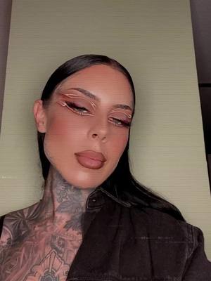 A post by @silenceoftheglam on TikTok caption: #makeuptutorial #fyp #tattoos 