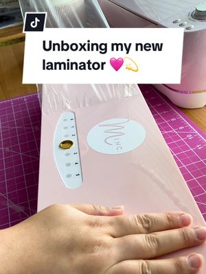 A post by @ivytart on TikTok caption: Found the cutest laminator 🩷💫 #minclaminator #heidiswappmincmachine #pinklaminator #unboxing #unboxingasmr #pinkpinkpink #pinkcraftroom #pinkcraftsupplies 