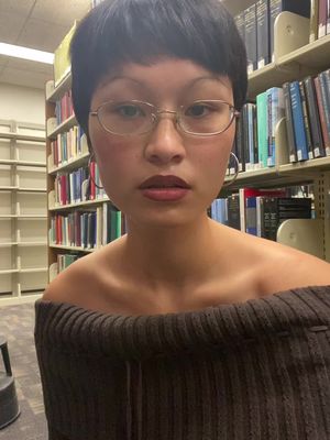 A post by @sheluvsrats97 on TikTok caption: Hiding in the book stacks to avoid studying 