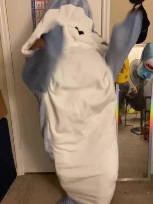 A post by @weightoffash on TikTok caption: This is the sexiest Halloween costume ever!!  #sharkcostume #sharktok #leftshark #sharkonesie #sharkattack #halloweenshark