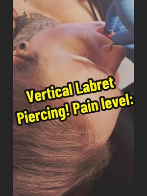 A post by @courtneynicole992 on TikTok caption: Heres to the people curious if the vertical labret hurts…. Id give it on the pain scale about a 7-8. Thankfully my piercer was amazing and the only part that was really painful was the needle sliding through the inside of my lip to come out the top of my lip. #verticallabret #piercinglovers #piercingpainrate #piercingvideo #verticallabretpiercing #piercingtok #momswithtattoos  #gaugespiercing #girlswithgauges #momswithpiercingsandtattoos #viewsproblem #MomsofTikTok