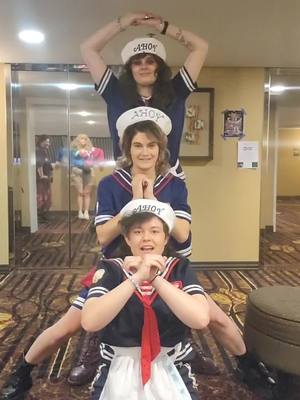 A post by @pippinpanic on TikTok caption: If we could shape-shift ideally we'd be recognized as specifically Steve, Billy, and Eddie. But it's equally as funny to assume we are Steve 3 times . . . . . . . . . #steveharrington #strangerthings #minneapolis #plymouth #eddiemunson #billyhargrove #cosplay #shitpost #animefusion #animefusion2023 #trio #dancegroup #idolgroup #metalsandwich #harringroveson #imkidding #butcanyouimagine 